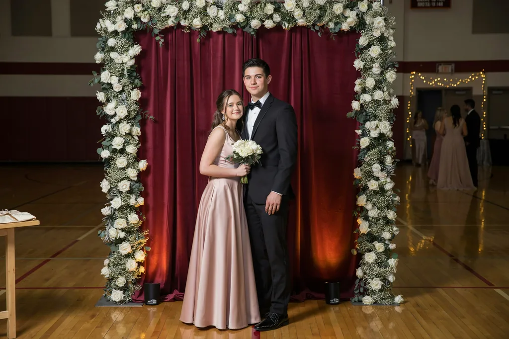 A couple at a Continental Studios prom portrait station.