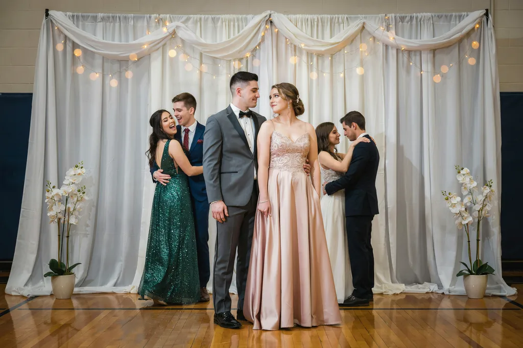 Students at a prom portrait station.