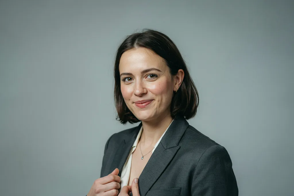 A teacher photographed for the staff directory by Continental Studios.