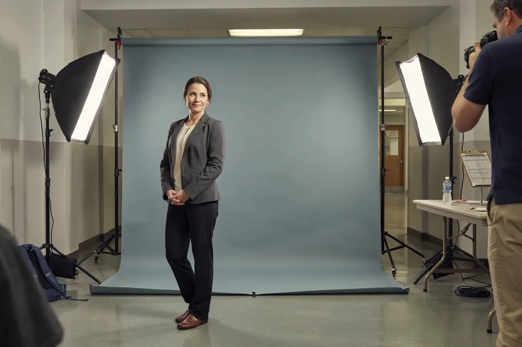 A faculty picture-day headshot station at a school.