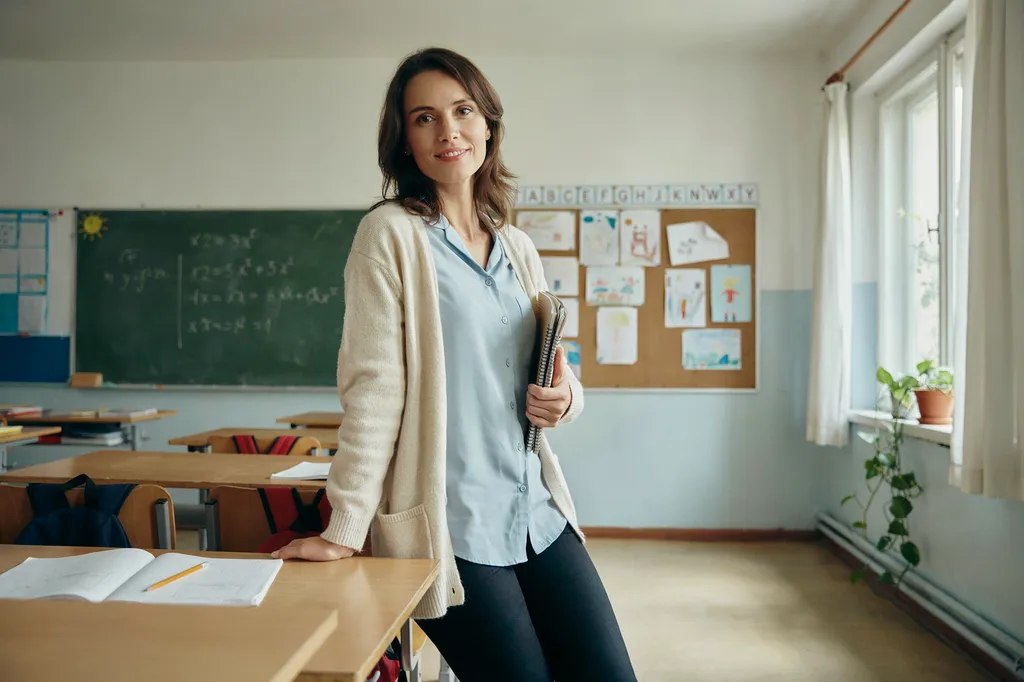 A teacher photographed in their classroom.