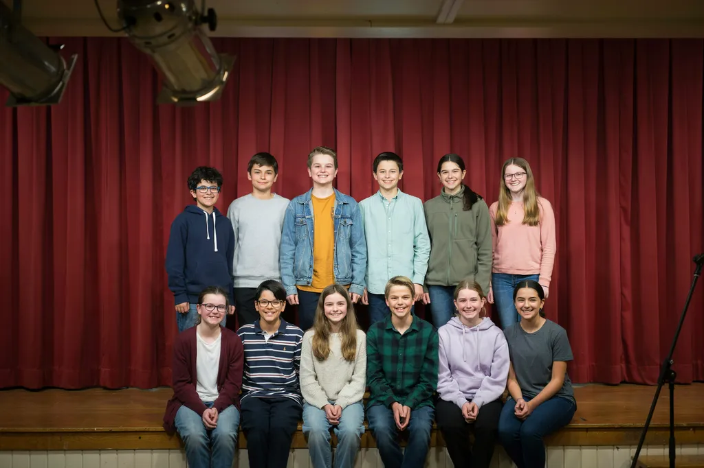 A small class group photographed in the auditorium.
