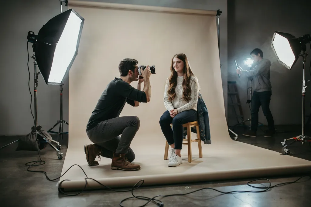 A Continental Studios photographer at work during a studio senior session.
