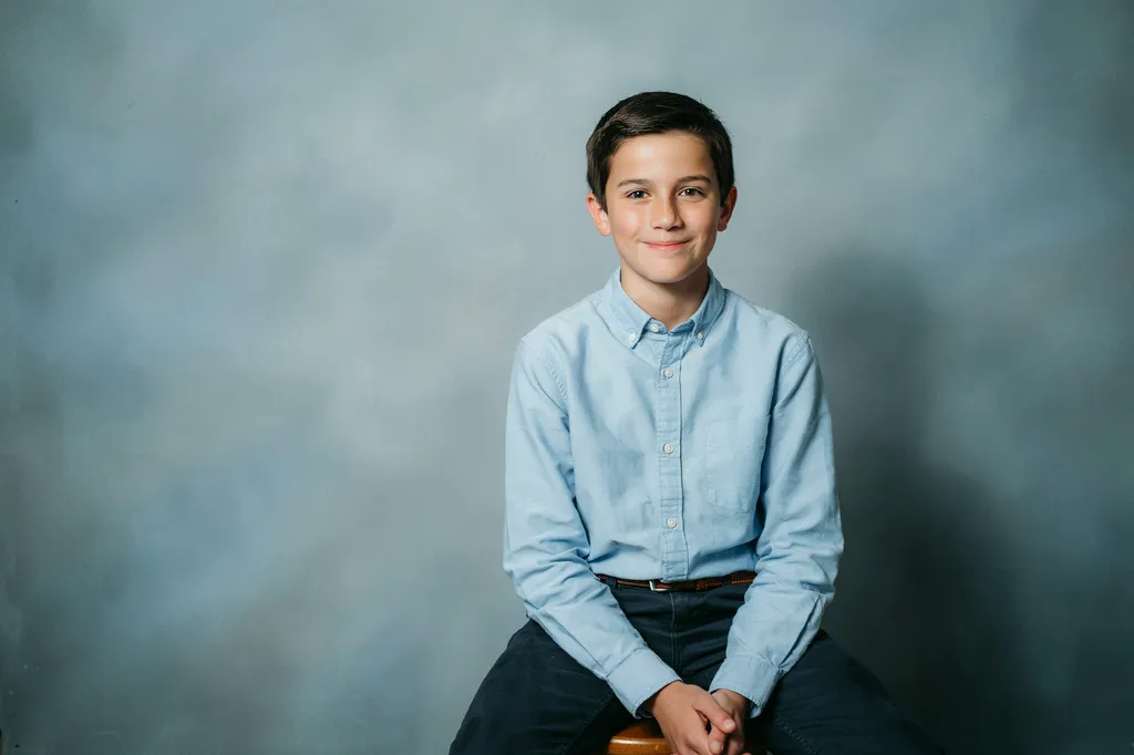 A middle school student photographed at a Continental Studios picture-day station.